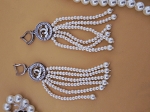 CC. SURGICAL METAL AND CRYSTAL EARRINGS 